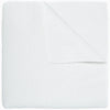An Organic Hand Stitched White Quilt by John Robshaw folded on top of a white surface.