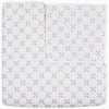 A Layla Lavender quilt by John Robshaw, made from cotton voile, with a cross pattern in white and purple, inspired by Mughal gardens.