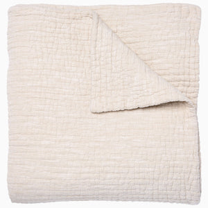 A Vivada Sand Woven Quilt, hand-stitched quilt, by John Robshaw.