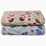 Two Tejal Azure Throw blankets with diamond pattern stitching on top of each other. - 30497695596590