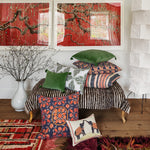 A John Robshaw Velvet Moss Decorative Pillow is on the floor, showcasing the exceptional craftsmanship of Indian artisans. - 30484739555374