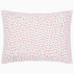 The Organic Hand Stitched Lotus Sham by John Robshaw is a white rectangular pillow sham, hand quilted from organic cotton voile with a soft cotton batting fill. It features a subtle pink stitched dotted-line pattern and a white border.