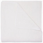 The Organic Hand Stitched White Quilt by John Robshaw features a beautifully textured, white woven design with one corner turned up to reveal its intricate hand stitching on both sides—ideal for layering with organic cotton quilts or other hand-stitched bedding to bring warmth and refined elegance to any bedroom.