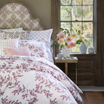 An Oha Lavender Organic Duvet with a floral pattern and a window, by John Robshaw. - 30784327352366