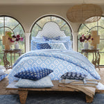 A bedroom with blue and white Elil Euro bedding, John Robshaw hand block printed pillows, and cotton linen. - 30801449615406