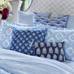 John Robshaw's Akash Azure Organic Duvet blue and white pillows on a bed. - 30784320372782