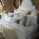 A Cinde Sage Organic Duvet by John Robshaw with a blue and orange comforter and pillows made from 200 thread count organic long staple cotton.