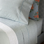 A Cala Sage Organic Sheets bed sheet with a blue and white pattern. (John Robshaw) - 30784330137646