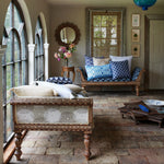 A unique and stunning living room floor with a brick pattern made from linen using Shibori printing technique, featuring the Pari Bolster by John Robshaw. - 30801465114670