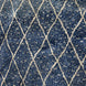 Blue Village 2 Wool Rug in blue with a textured surface and a white diamond lattice design.