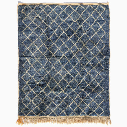 Blue Village Wool Rug with a white diamond pattern, rectangular shape, and fringed ends.