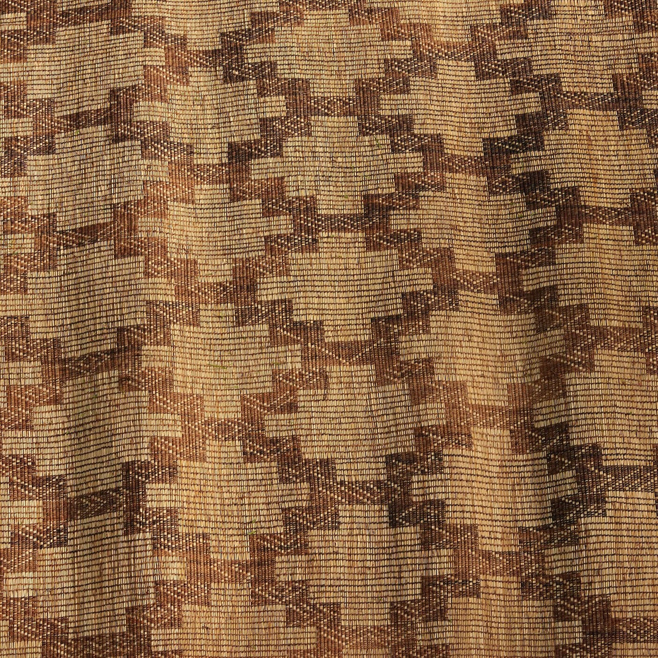 John Robshaw Tazarine Tuareg mat featuring a handwoven, repeating brown and tan geometric stepped pattern.