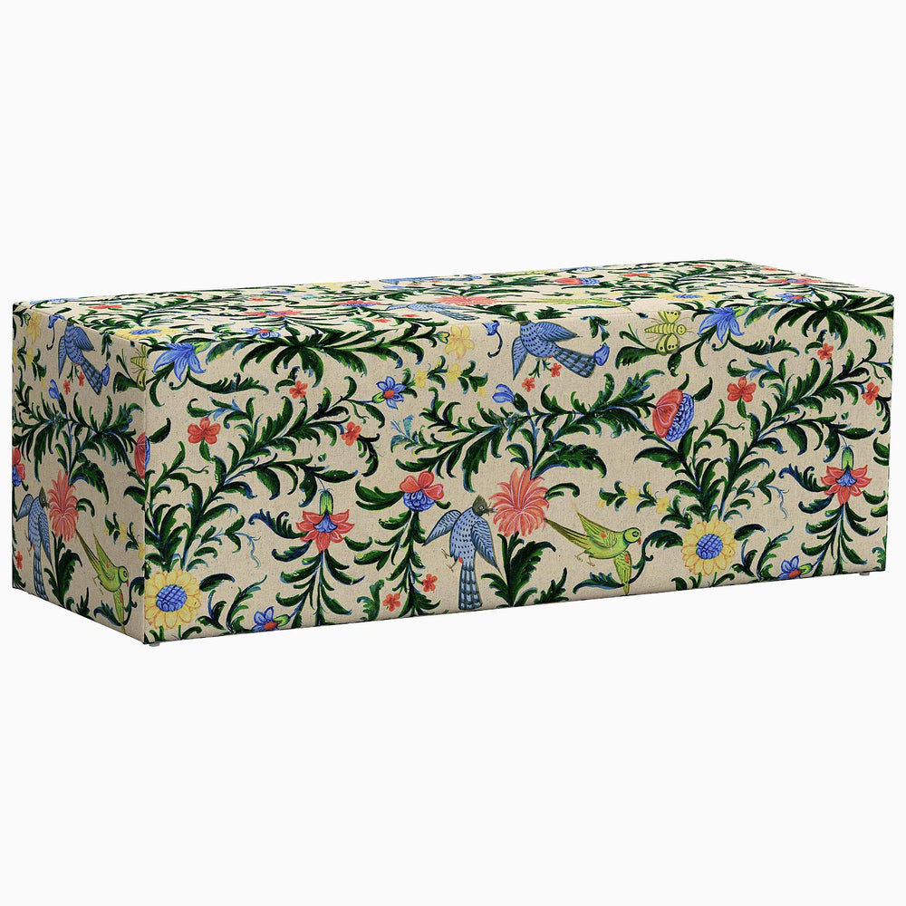 An exclusive Rathi Bench from John Robshaw with a floral pattern on it.