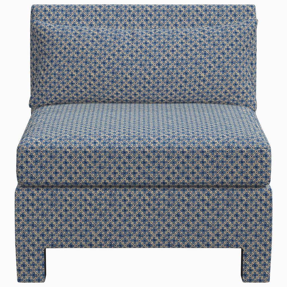 The John Robshaw Sameera Armless Chair is a custom seating arrangement featuring exclusive fabrics in a blue upholstered design with a geometric pattern.