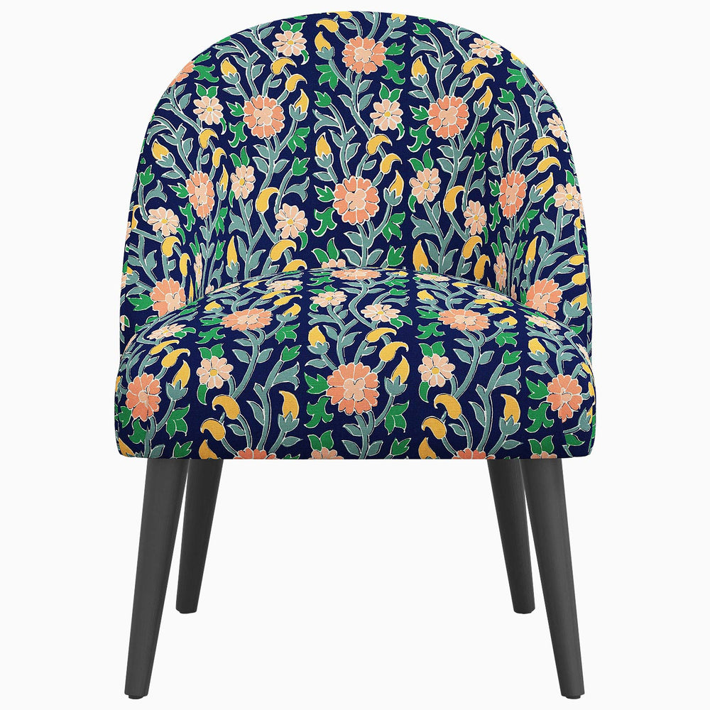 A Chetna Accent Chair with floral prints inspired by John Robshaw, featuring a Southeast Asian influence in its design.