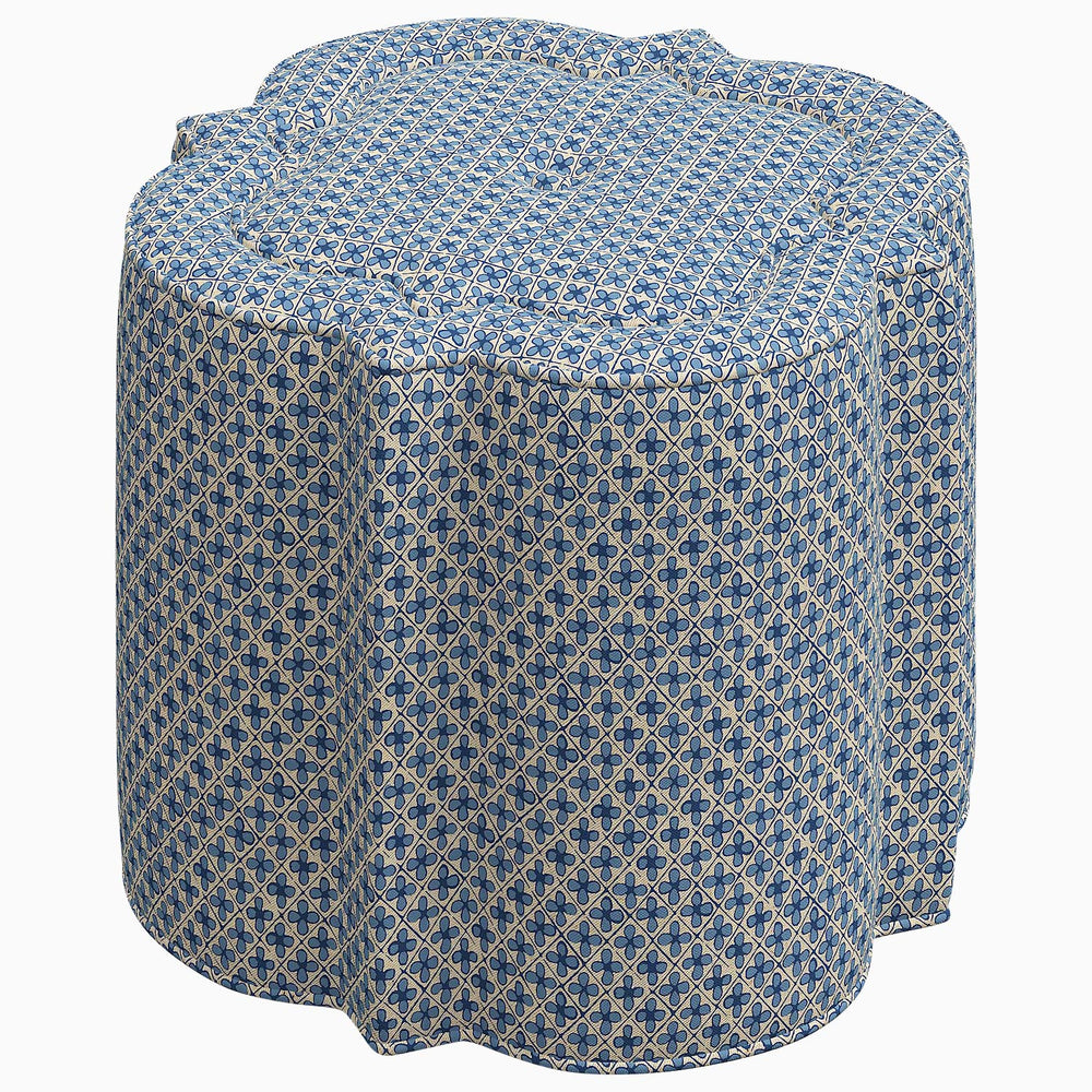 A blue and white Shiza Ottoman by John Robshaw adorned with a patterned swatch, perfect for an interior space.