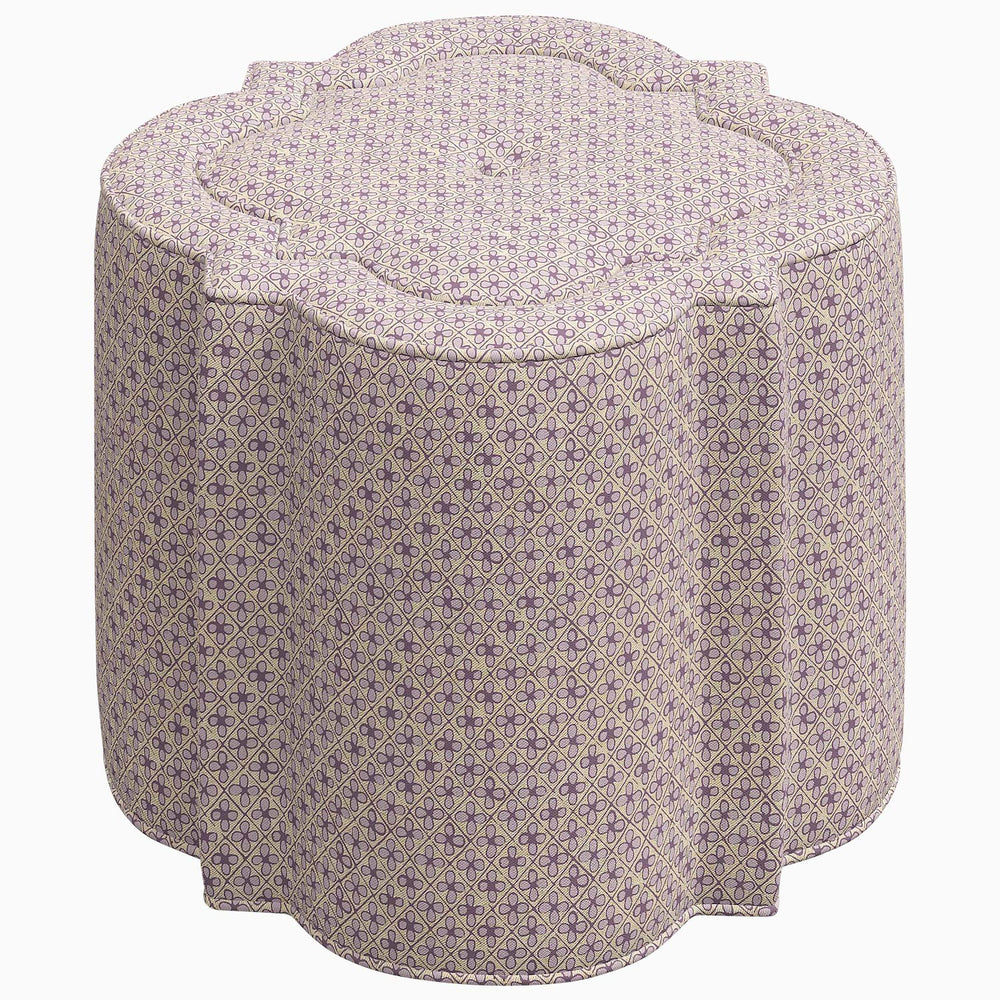 A Shiza Ottoman with a flower pattern on it by John Robshaw.