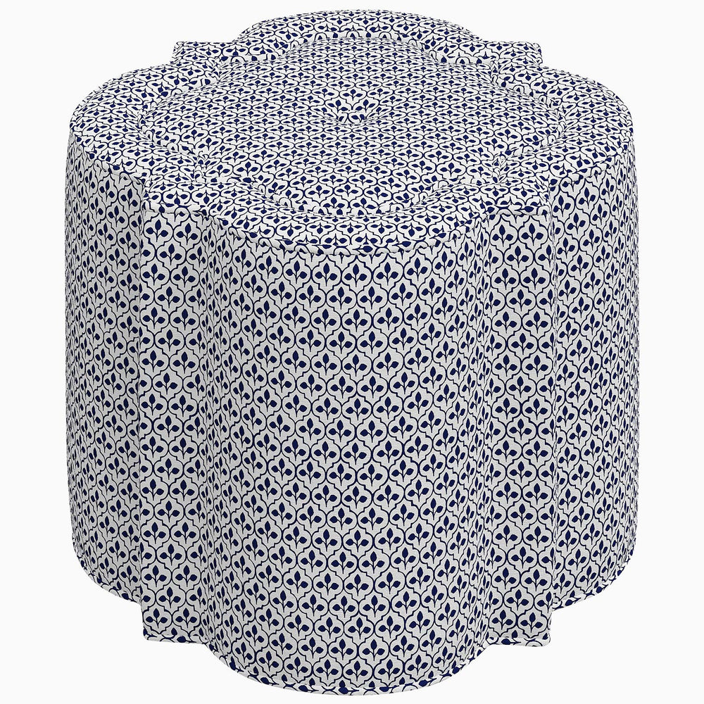 An interior Shiza Ottoman with a blue and white patterned swatch on a white background, by John Robshaw.