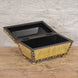 The Suvarna Bone Inlay Box by John Robshaw features a rectangular design with an open hinged lid, adorned with elegant gold and black detailing, and resting on small round feet. Placed on a wooden surface against a light brick wall, it serves as the perfect decorative storage box for your cherished keepsakes.