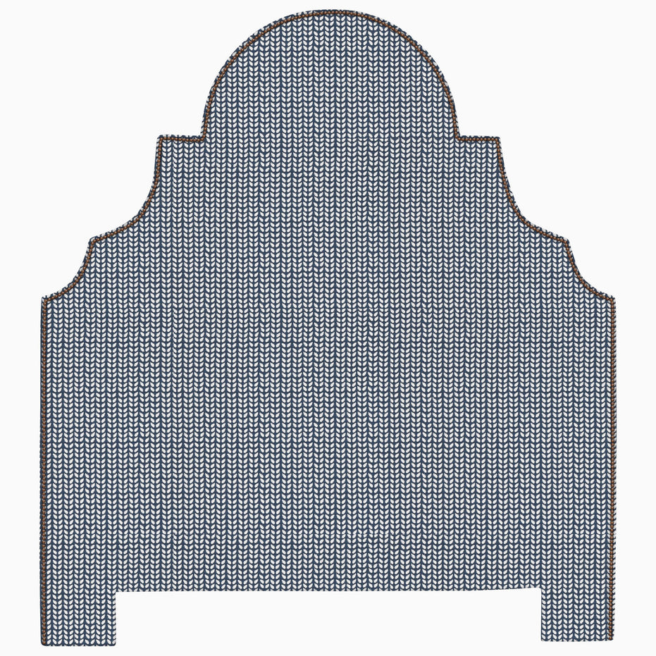 A Custom Dara Headboard by John Robshaw, with a blue and brown pattern, available for shipping.