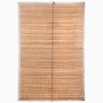 The Bipin Tangerine Chik Blinds from John Robshaw Textiles are handmade with thin bamboo slats and white edge binding, reflecting traditional Indian chik blinds against a pristine white background. - 31884733218862