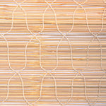 The Bipin Tangerine Chik Blinds by John Robshaw Textiles feature a close-up of a woven bamboo mat with vertical and horizontal strips connected by string. These blinds have a natural light brown color and textured surface, reminiscent of traditional Indian chik blinds. - 31884733251630