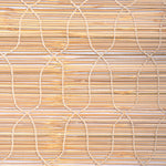 Close-up view of Jaya Azure Chik Blinds by John Robshaw Textiles featuring a geometric pattern with intersecting white strings on handmade bamboo. - 31879864057902