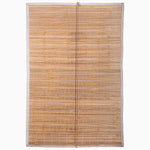 The handmade Bamboo Chik Blinds, crafted by John Robshaw Textiles, feature thin white strings and light-colored fabric edges for a serene bamboo window treatment that enhances any space with subtle elegance. - 31884735414318