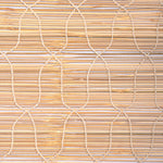 Close-up of a woven bamboo mat featuring intersecting lines and natural beige tones, evoking the look of John Robshaw Textiles' Bamboo Chik Blinds. - 31884735447086