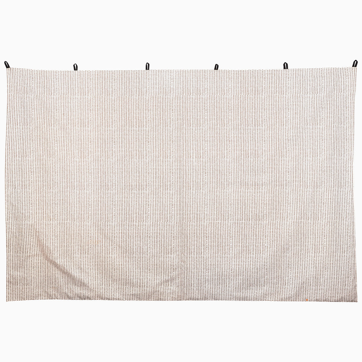 John Robshaw Trotting Camel Tapestry, a rectangular hand-painted piece with a white-to-brown ombre pattern of repeating chevrons, suspended by five black loops.