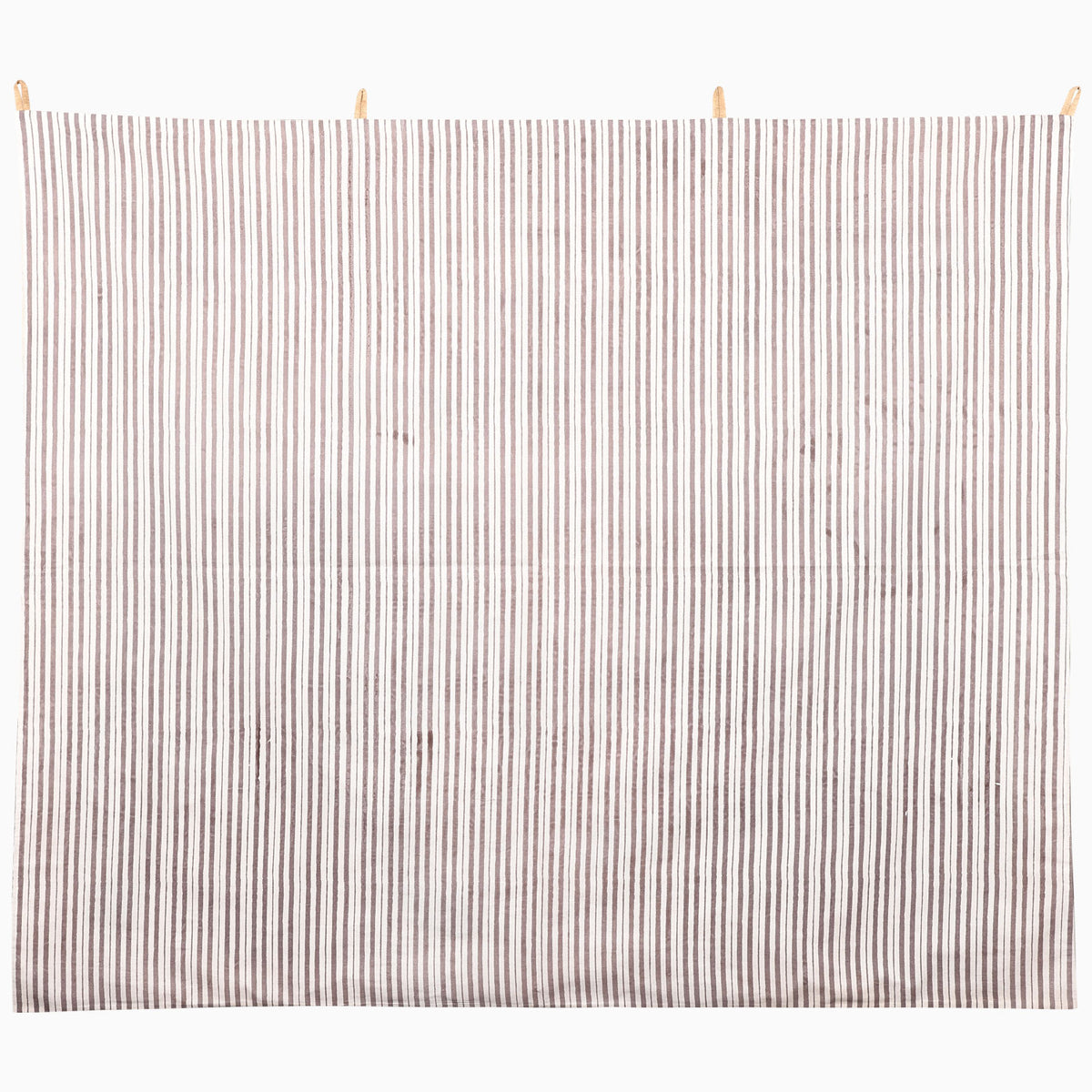 We Gallop Tapestry featuring a rectangular wall hanging of vertical brown and white stripes, suspended from wooden clips as cattle wall art.