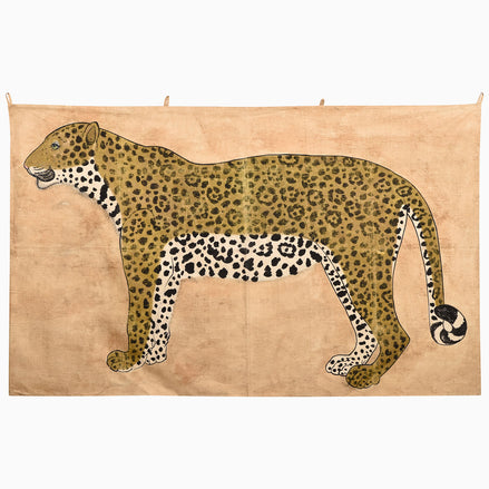 A Watchful Stance Tapestry featuring a stylized, side-profile illustration of a leopard in the style of Indian folk art on a tan background.