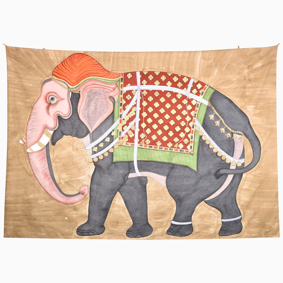 A Back This Way Tapestry featuring a grey elephant adorned with an orange headpiece and an ornate red and green patterned embroidered jhool.