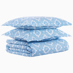 A stack of 200 thread count Akash Azure Organic Duvet blue and white pillows made from organic long staple cotton, stacked on top of each other. (Brand Name: John Robshaw) - 30768953163822