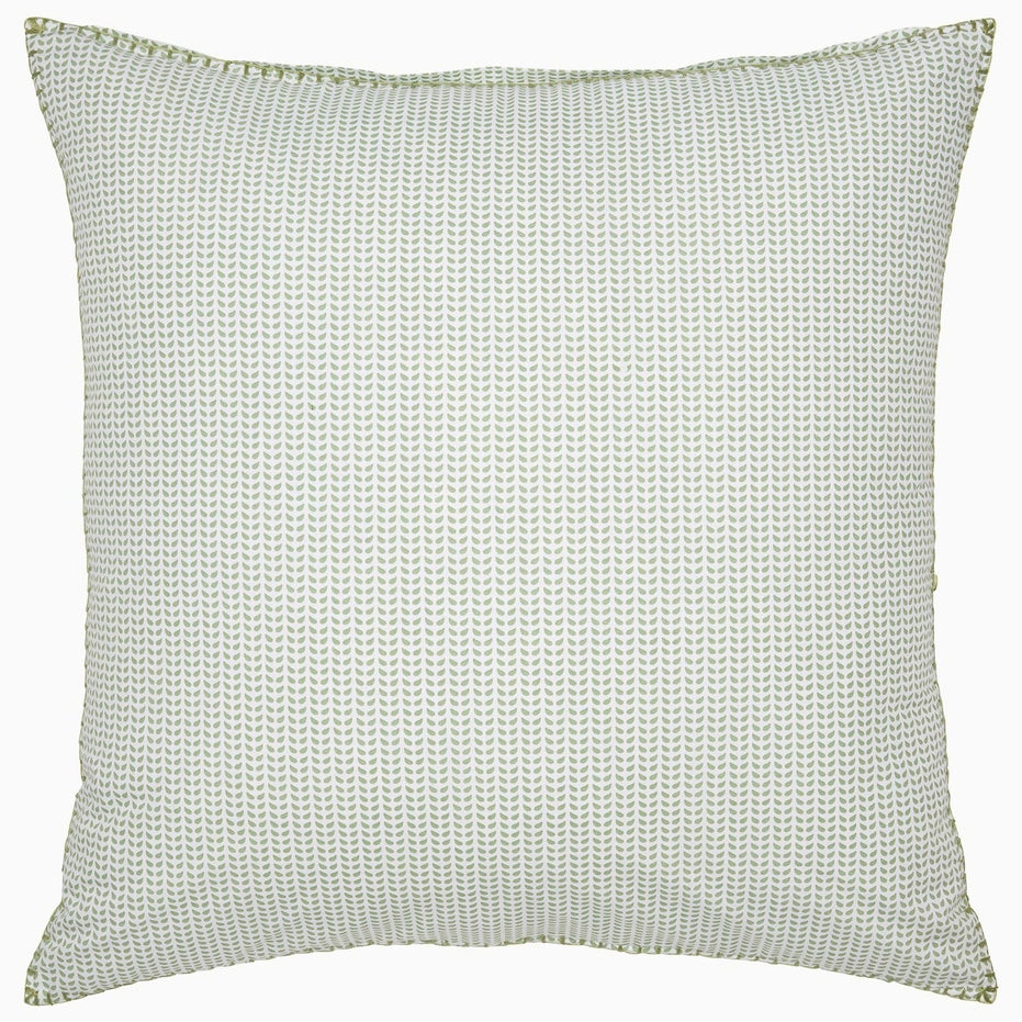 An organic long staple cotton pillow with dots on it (Cinde Sage Organic Duvet by John Robshaw).