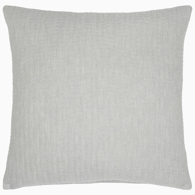 A Vivada Light Gray Woven Quilt with a cotton chambray coverlet on a white background. (by John Robshaw)