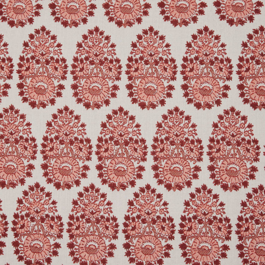 A red and white paisley pattern on a white background, inspired by fabric making traditions using the Lanka Berry Performance Fabric by John Robshaw.