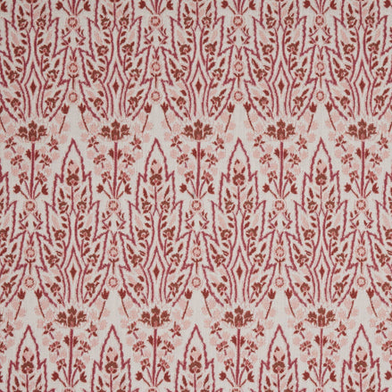 A red and white floral pattern inspired by Mughal gardens, featuring the Marmar Berry Performance Fabric by John Robshaw.