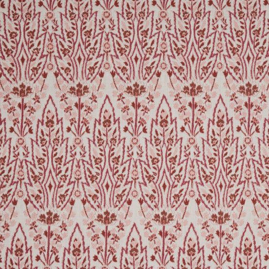 A red and white floral pattern on a white background inspired by Mughal gardens, featuring the Marmar Berry Performance Fabric by John Robshaw.