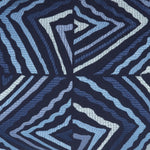 The Zain Kidney Pillow by John Robshaw features a textured, abstract design of overlapping, wavy, blue and black geometric shapes reminiscent of Shibori printing on a cotton linen fabric. - 31263928188974