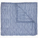 A Nandi Indigo Quilt by John Robshaw, hand quilted and featuring blue stripes, folded on top of itself.
