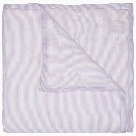 A Nandi Lavender Quilt, made by John Robshaw, on a white background, made of cotton.