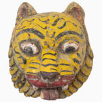 A John Robshaw wooden Yellow Tiger Mask inspired by tribal art from India, featuring a vibrant yellow face. - 30497640513582