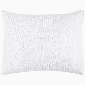 An Organic Hand Stitched White Quilt from John Robshaw with a cotton voile coverlet.