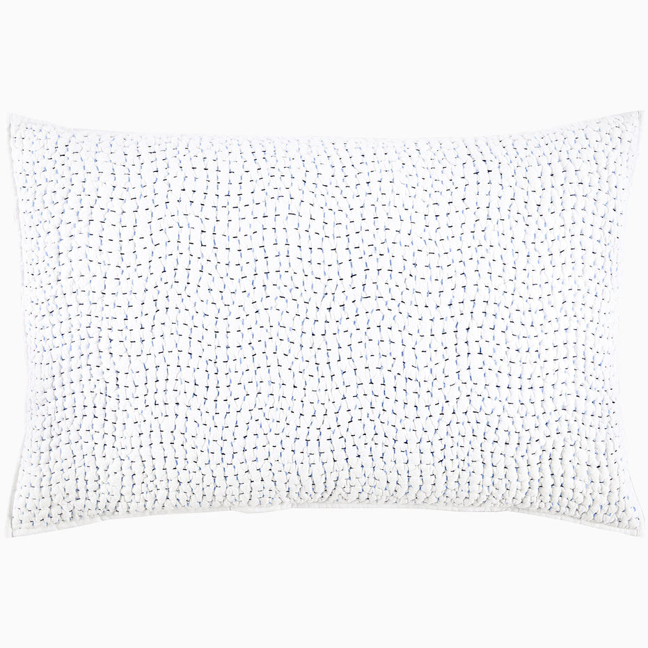 A John Robshaw Organic Hand Stitched Light Indigo Quilt with blue dots.
