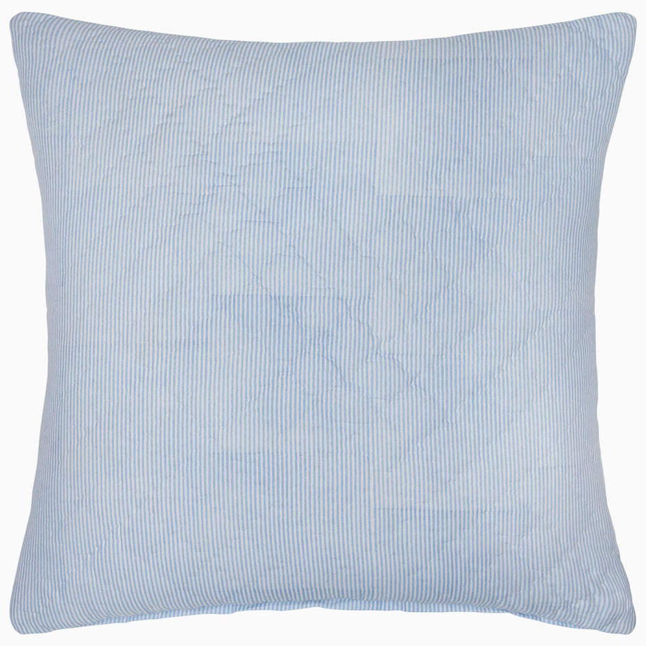 A Nandi Light Indigo Quilt by John Robshaw with a quilted pattern made of cotton voile.