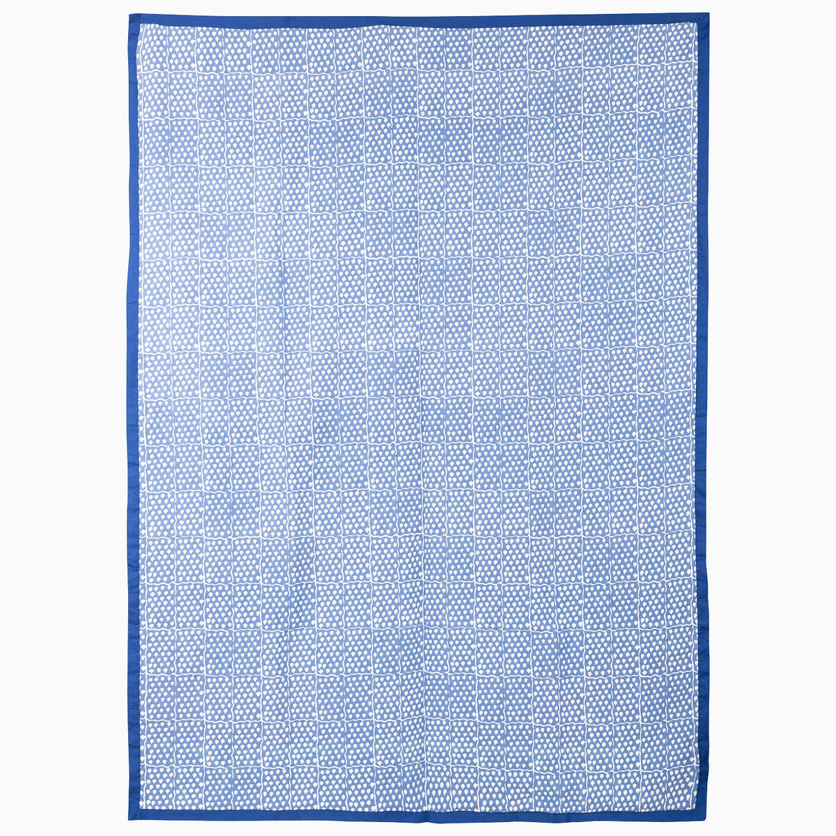 Jaipur Twilight Suzani Blanket featuring a blue and white geometric grid pattern with embroidered botanical motifs and a solid blue border.