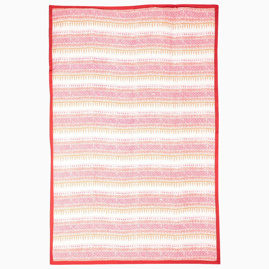 Red Clay Suzani Blanket featuring a white background with horizontal bands of pink and orange geometric patterns and a solid red border.