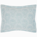 A blue and white Adesh Mist Duvet Set pillow with a woven flower motif by John Robshaw. - 30765677871150