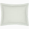 A John Robshaw Cinde Sage Organic Duvet with a green polka dot pillowcase.